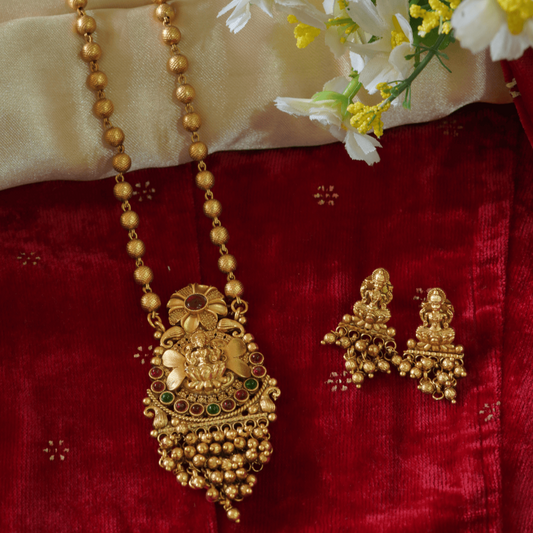 Stunning Golden Motifs Floral Laxmi Temple Pendant Set