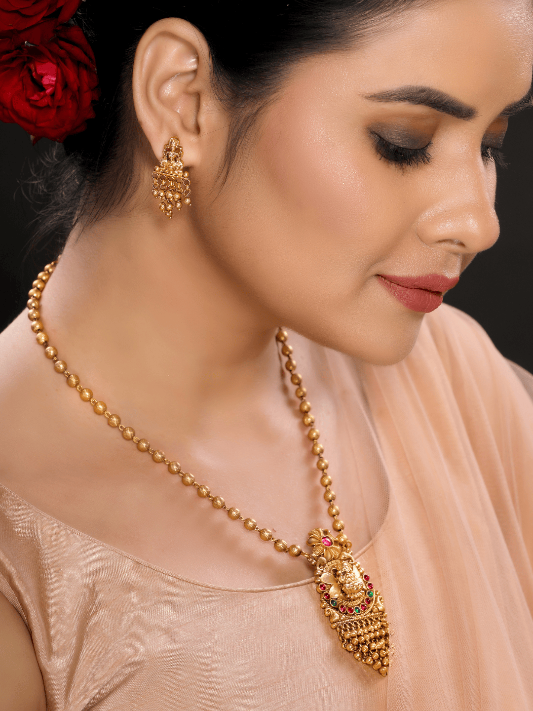 Stunning Golden Motifs Floral Laxmi Temple Pendant Set
