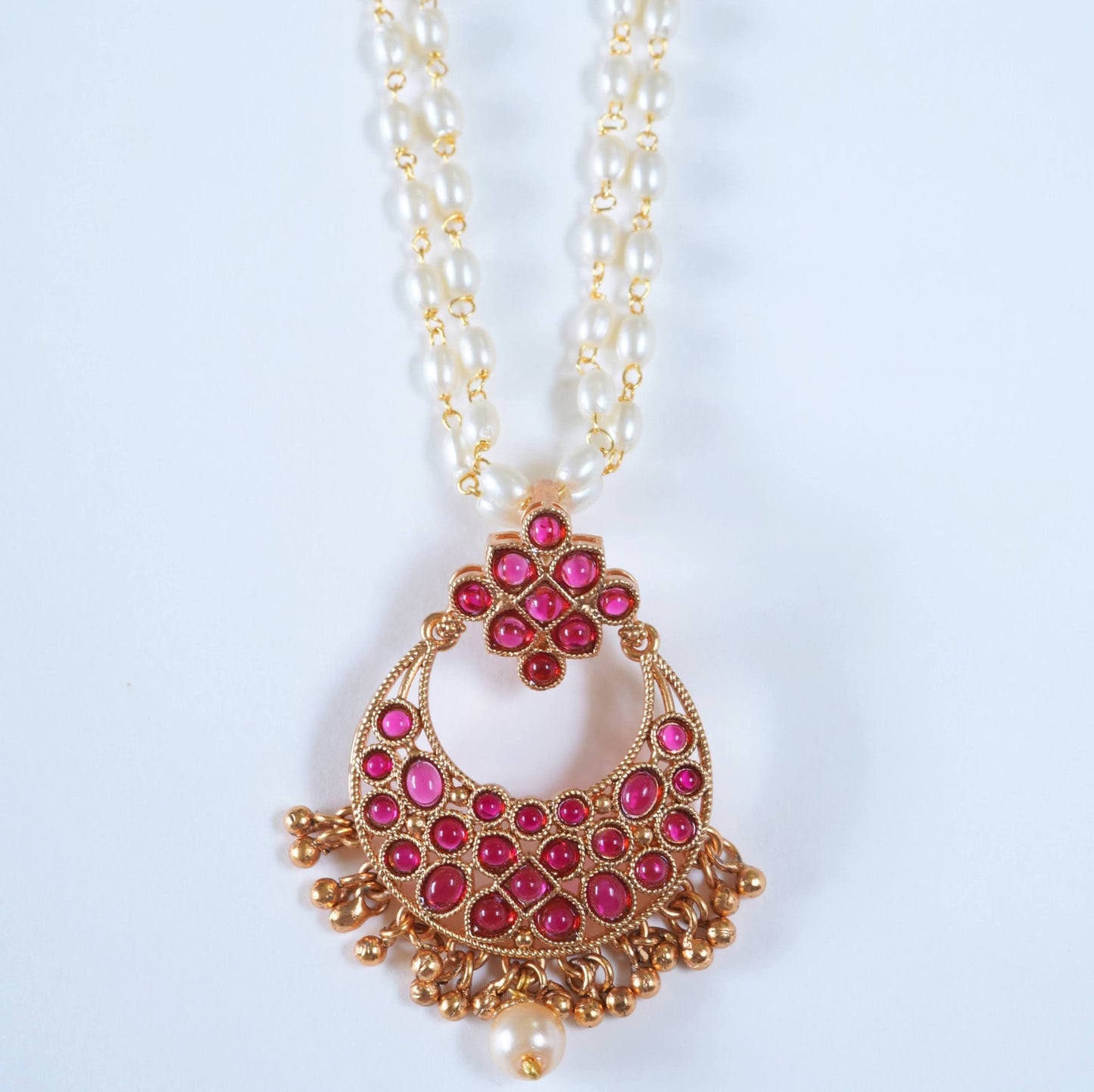 Radiant Ruby Studded Pearl Pendant Set with Jhumkas