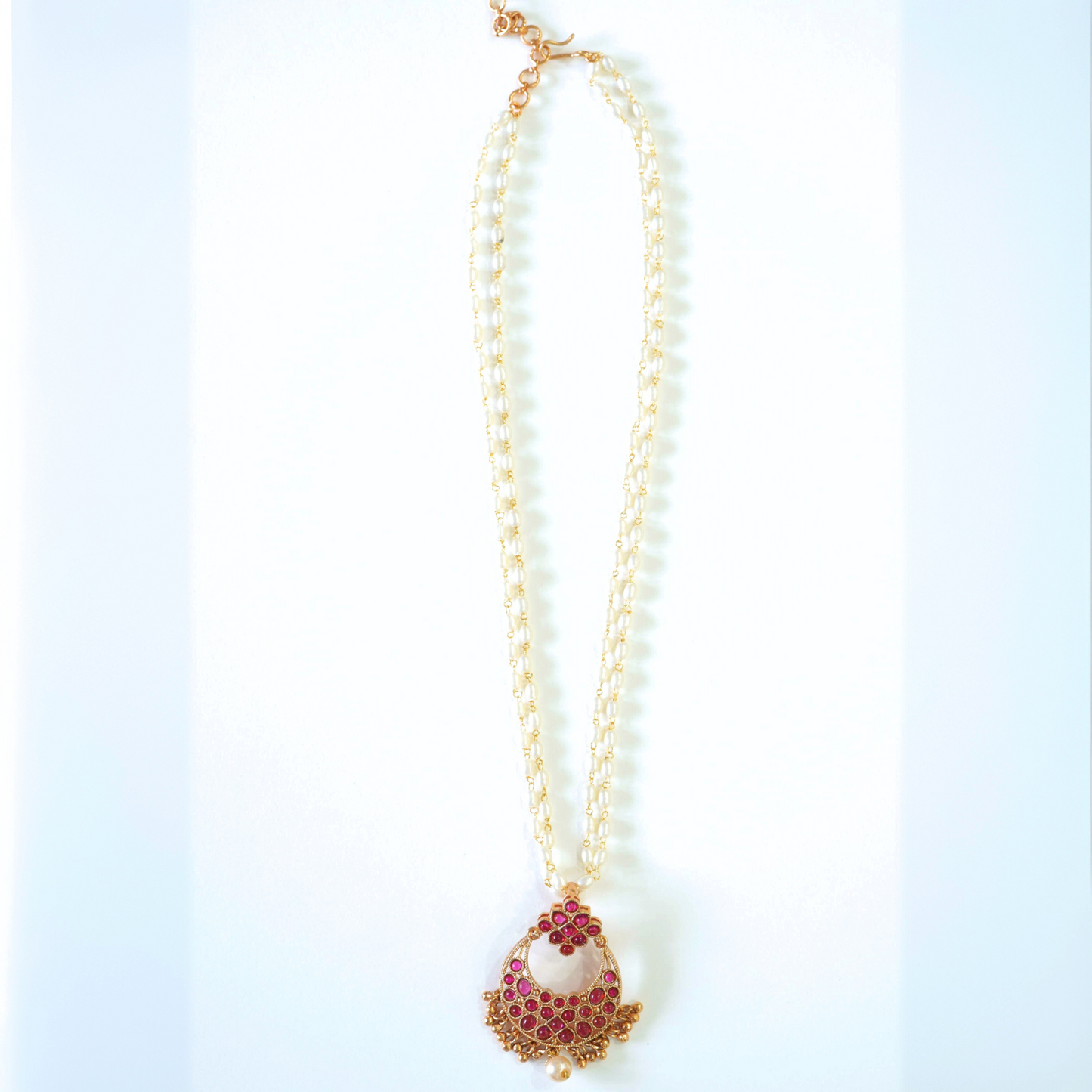 Radiant Ruby Studded Pearl Pendant Set with Jhumkas