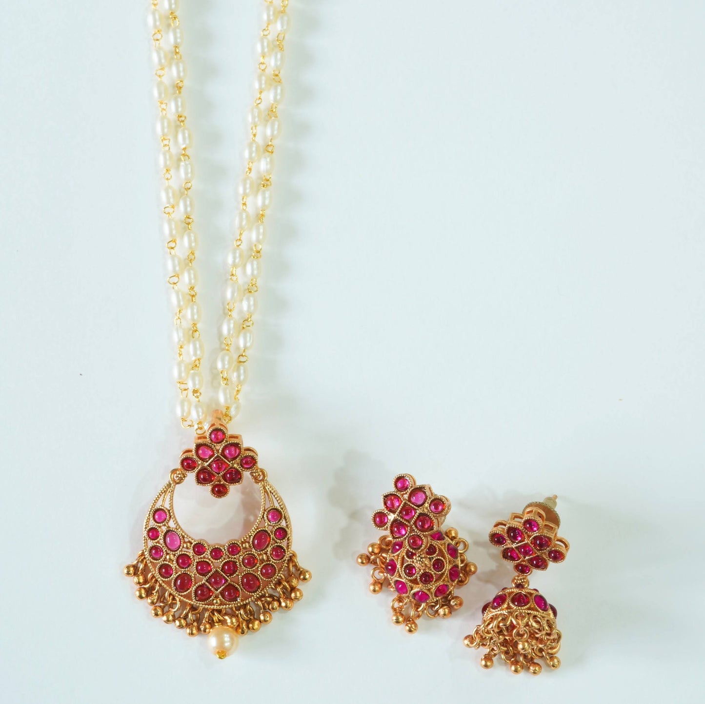 Radiant Ruby Studded Pearl Pendant Set with Jhumkas