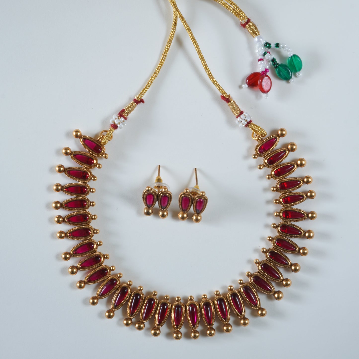 Evergreen Antique Matte Gold Conical Red Kemp Stone Necklace Set