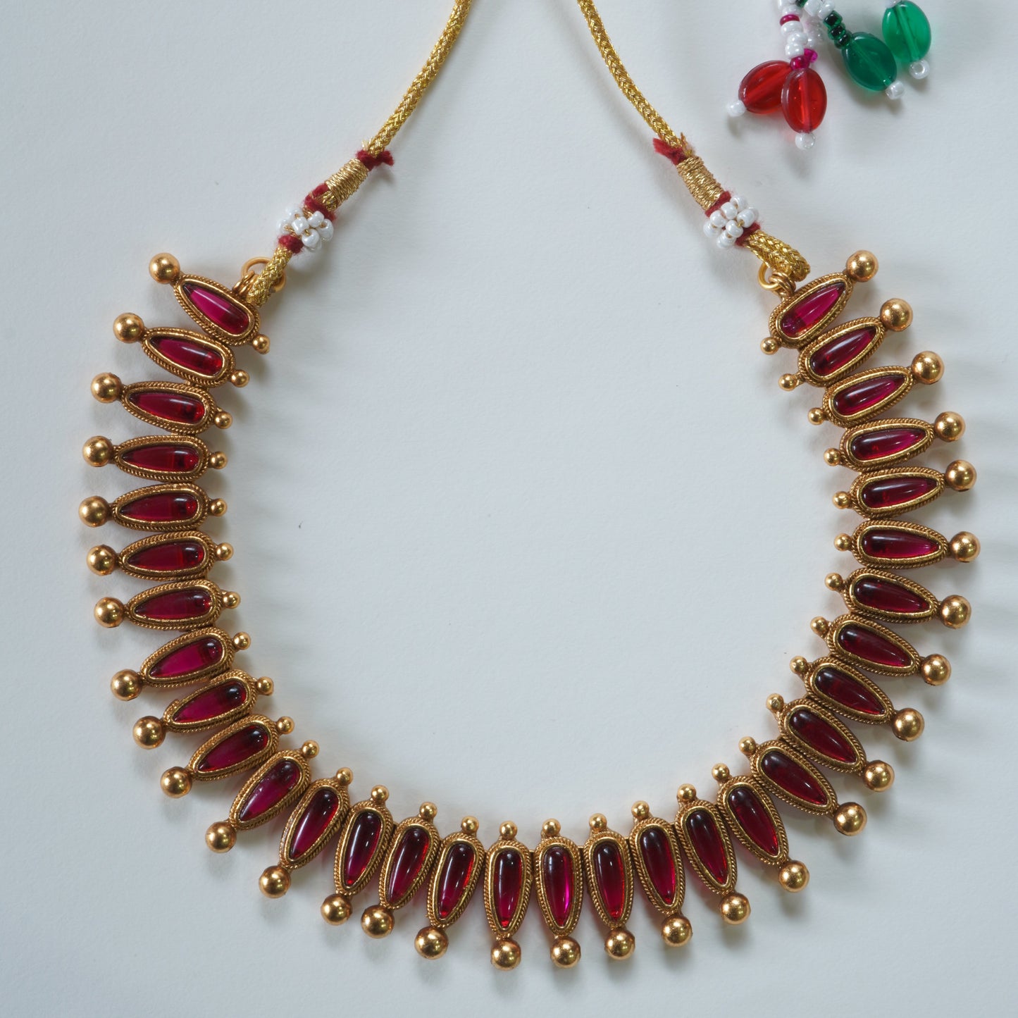 Evergreen Antique Matte Gold Conical Red Kemp Stone Necklace Set