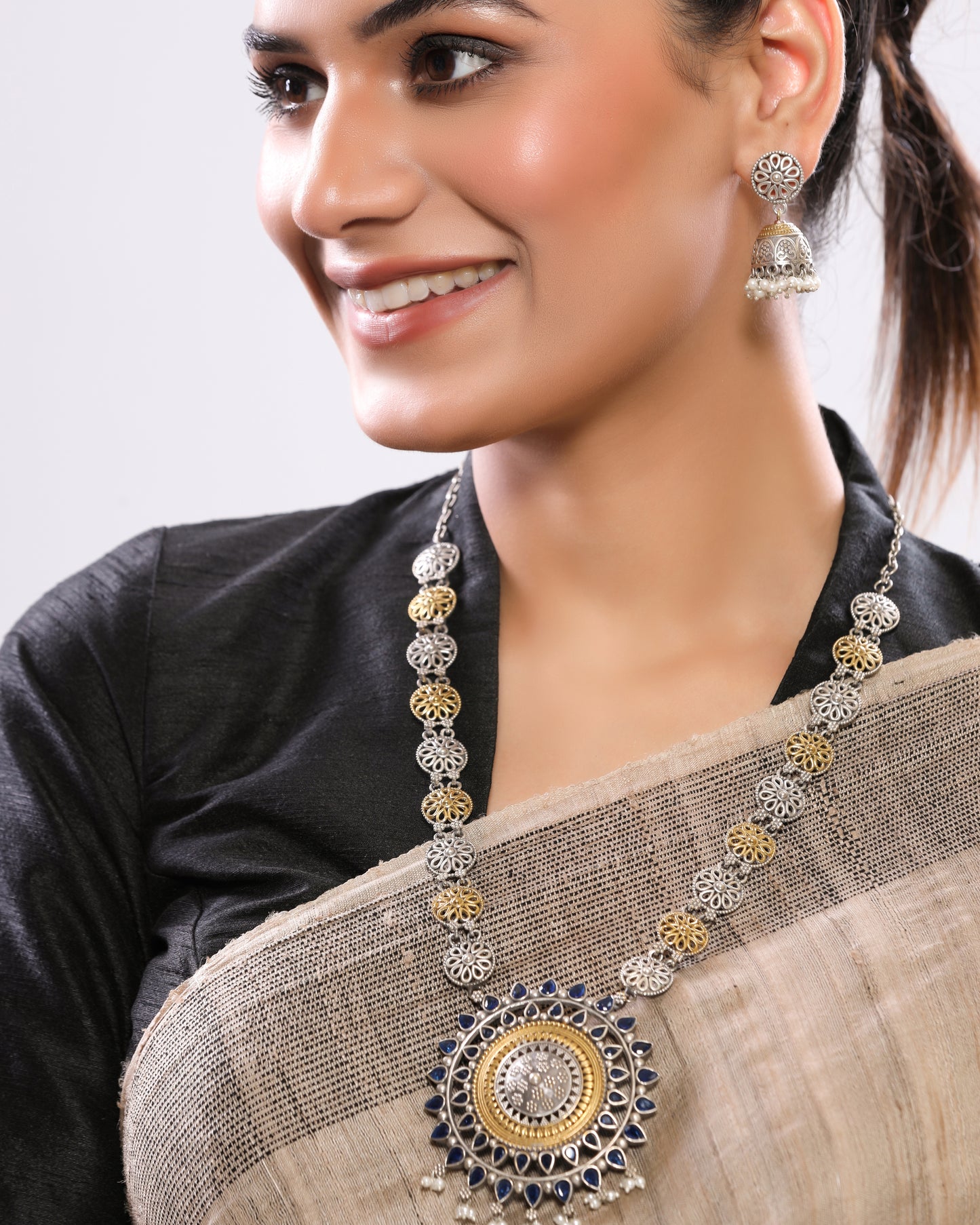 Dual-Tone German Silver Necklace Set with Blue Stone Pendant & Jhumka Earrings