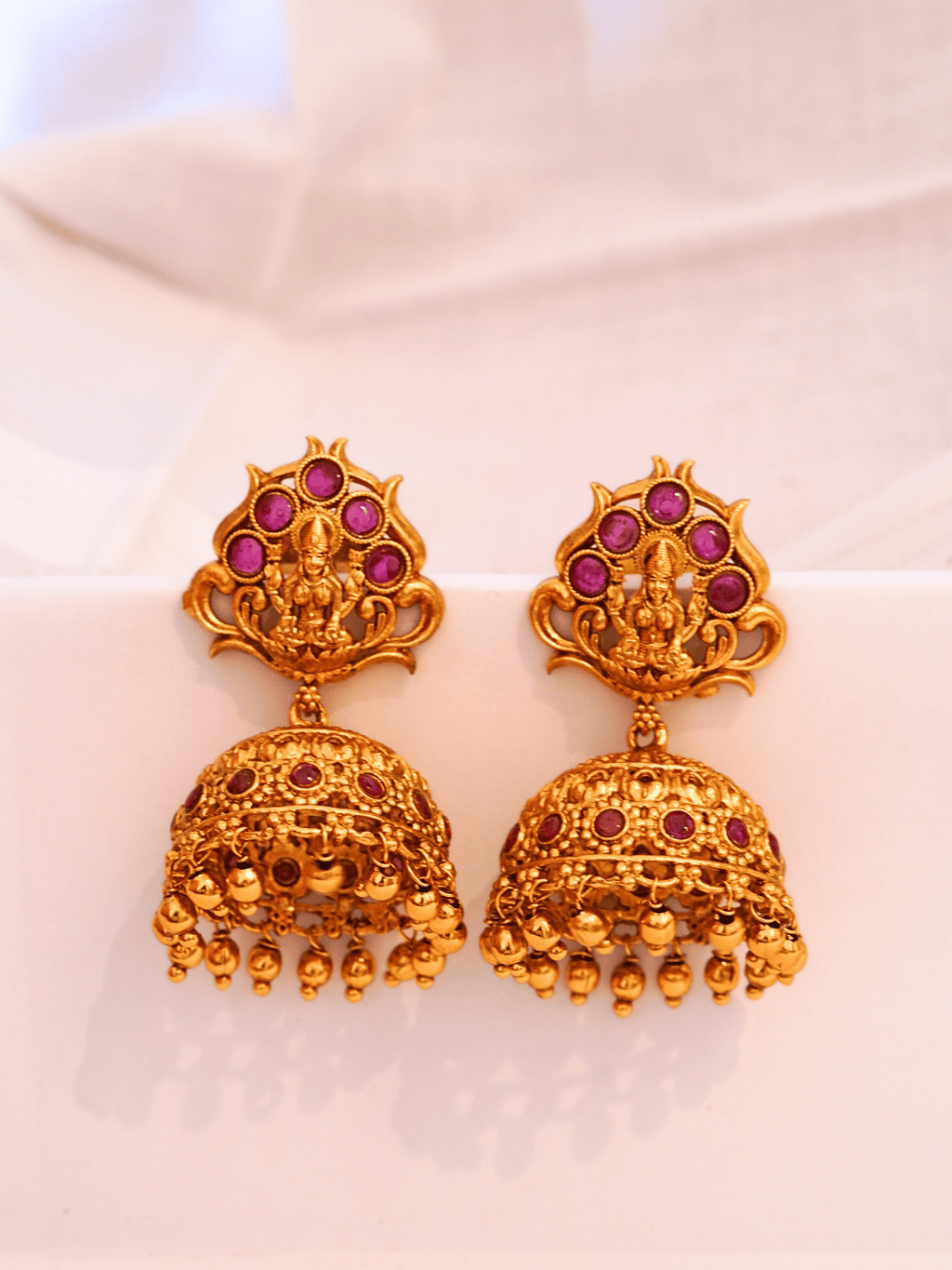 Timeless Faux Ruby Studded 22KT Gold Plated Brass Laxmi Temple Jhumka