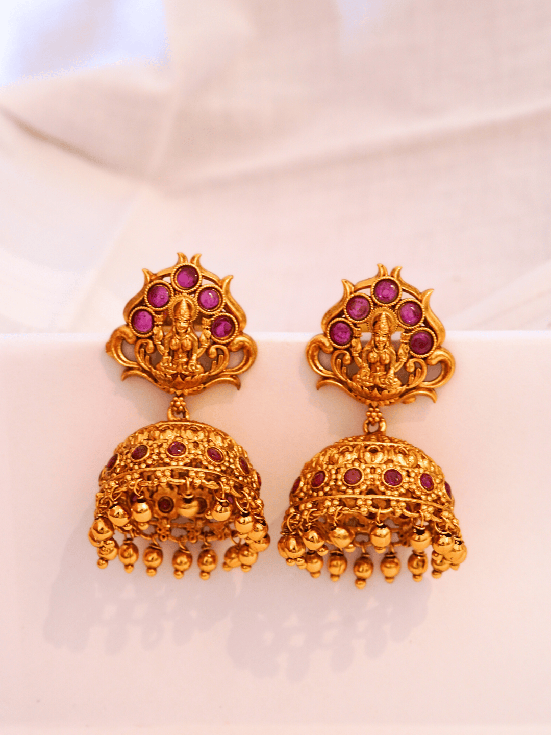 Timeless Faux Ruby Studded 22KT Gold Plated Brass Laxmi Temple Jhumka