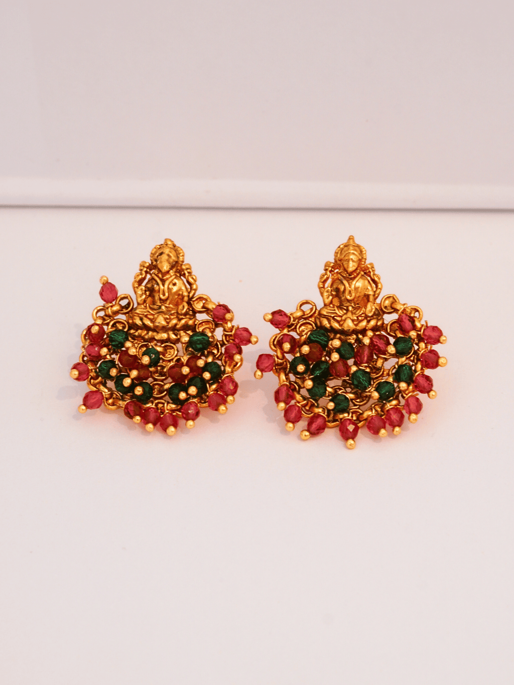 Ethnic Laxmi Temple Brass Studs with Red & Green Crystals in 22KT Gold Matte