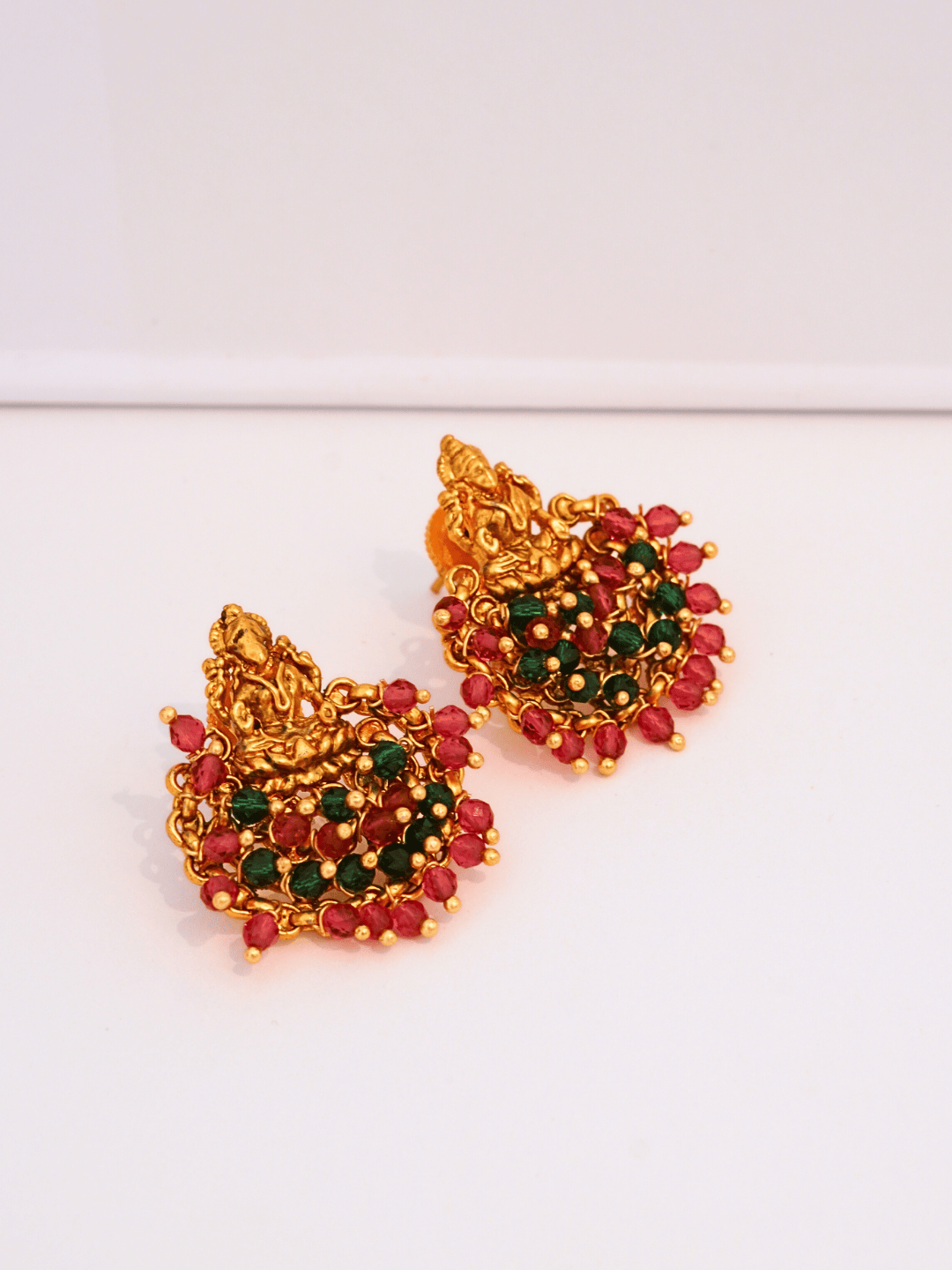 Ethnic Laxmi Temple Brass Studs with Red & Green Crystals in 22KT Gold Matte