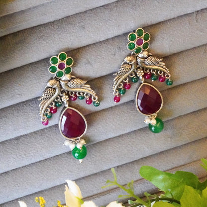 Enchanting Floral Bird Motif Oxidized Dangler Earrings with Lovely Pink & Green Jaipuri Stones & Pearls