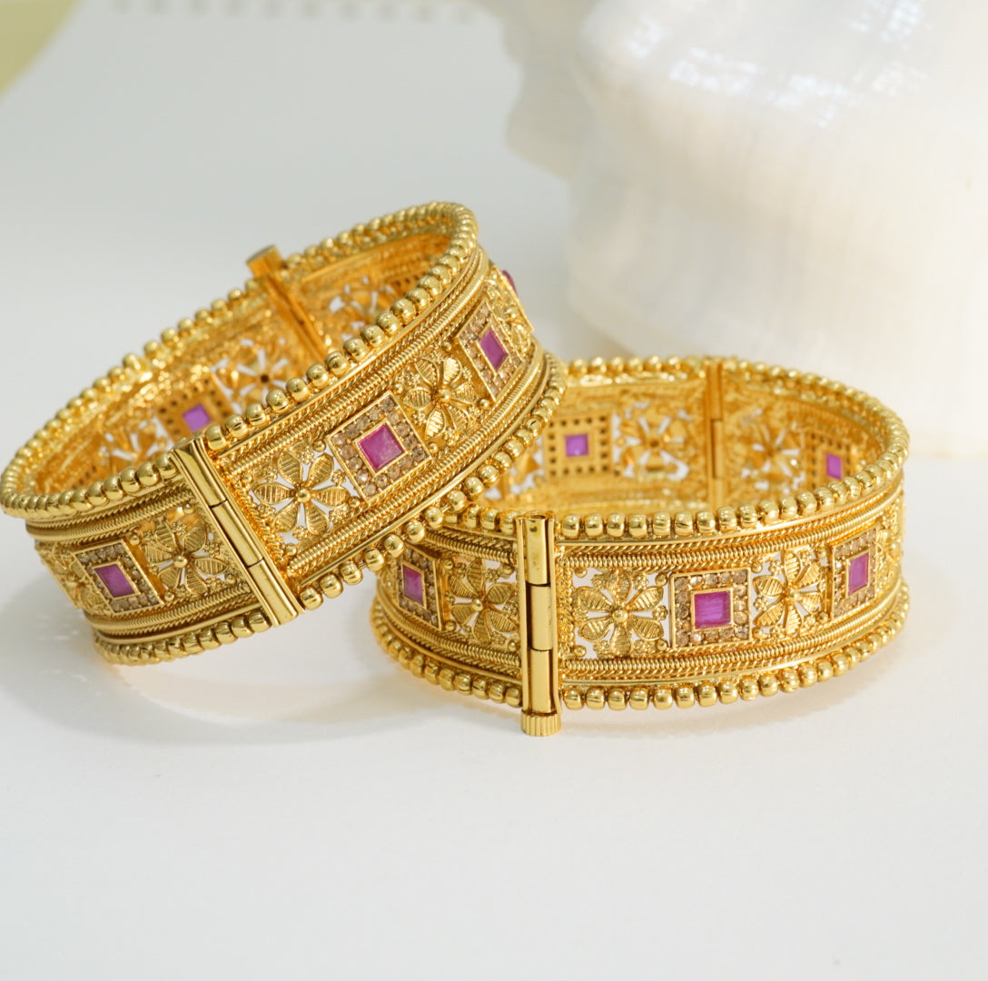 Golden Beaded Edged Ruby Studded Alternate Floral & Square Patterns Openable Traditional Broad Brass Kada in 22KT Gold Plating Matte Finish