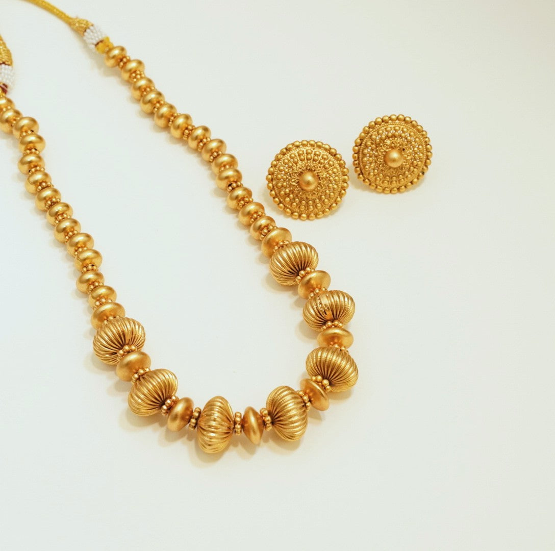 Oval Slope Down Beaded High Toned Brass Matte Finish Gold plated Necklace Set with Stud Earrings