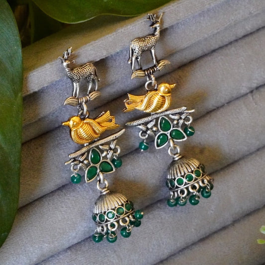 Striking Green Jaipuri Stone n Ornate Deer-Bird Design Dual toned Oxidized Jhumka Earrings