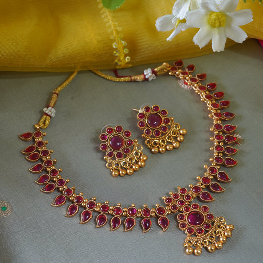 Regal Ruby-Studded Leafy Matte Gold-Plated Traditional Necklace Set