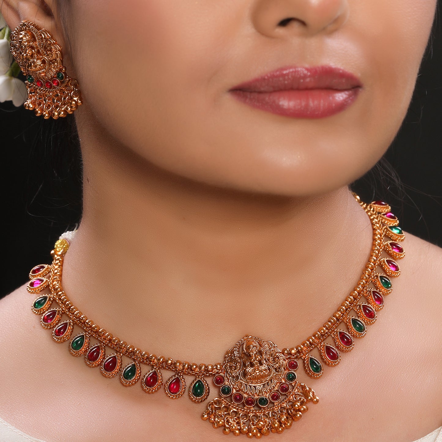 Traditional Temple Brass Necklace set with Stud Earrings in Matte Gold Finish Adorned with Ruby and Green Crystal Beads