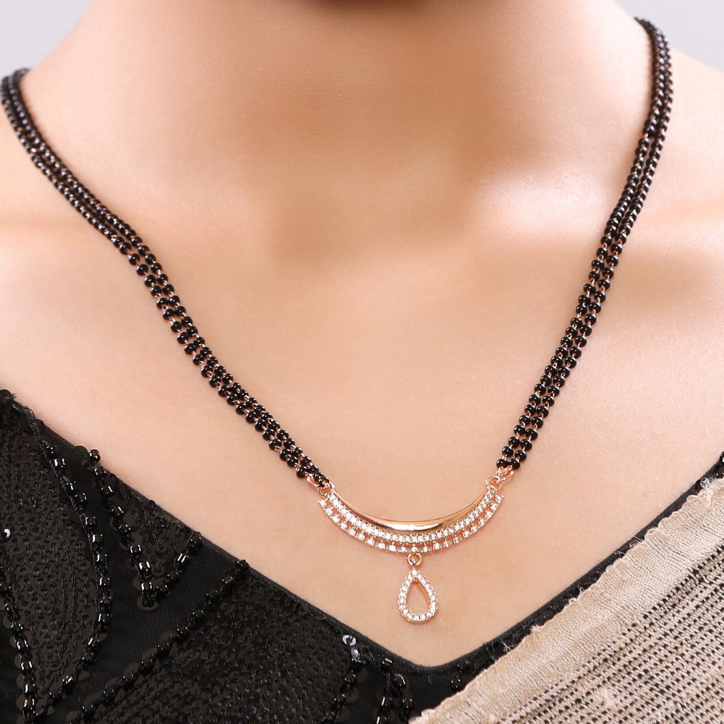 High Toned Rose Gold Plated American Diamond Studded Tripple Layer Drop Pendant Linear Chain Single Beaded Mangalsutra