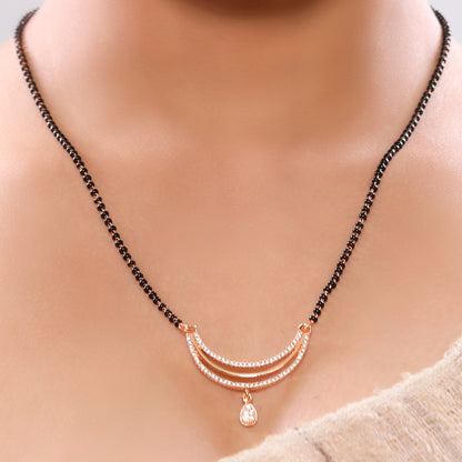 Contemporary Linear Chain Single String Mangalsutra in Rose Gold Plating Studded American Diamonds in Alternate Tripple Layered Drop Pendant