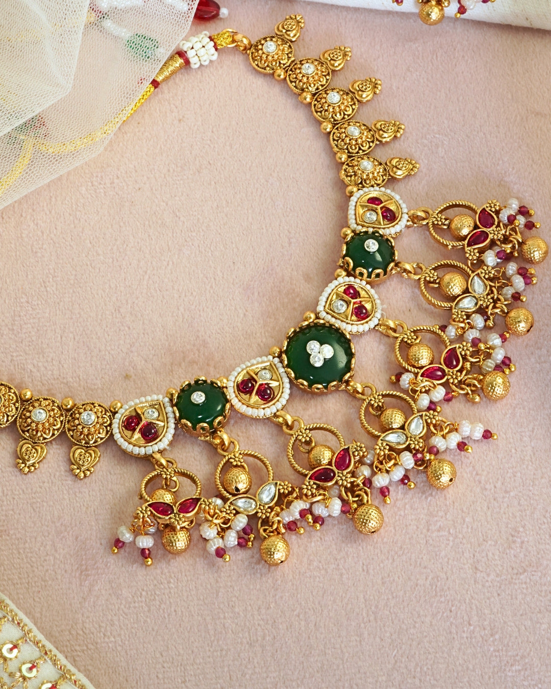 Traditional Emerald Studded Gold-Toned Beaded Necklace Set