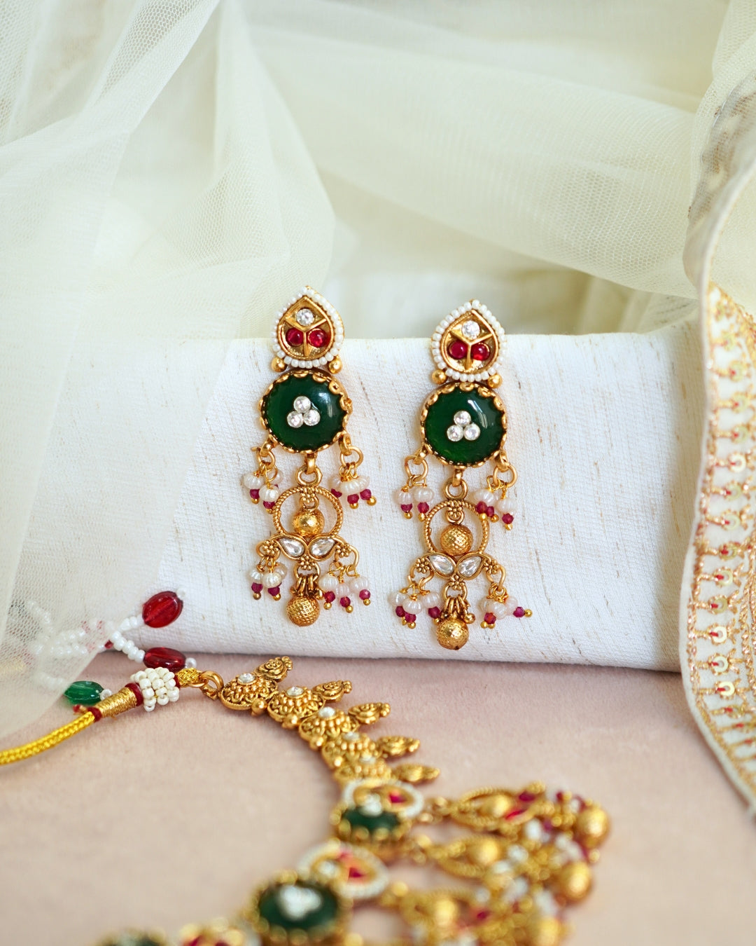 Traditional Emerald Studded Gold-Toned Beaded Necklace Set