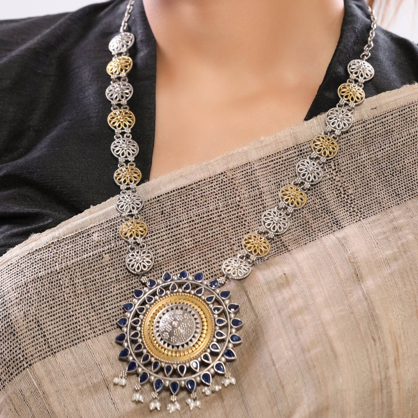 Dual Tone German Silver with Large Round Pendant studded with Blue Stone and Crystals with Jhumka Earrings