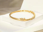 Sleek Golden Bracelet studded with fine American Diamonds