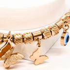 Elegant Rose Gold Bracelet with Evils Eye and Butterfly Charms