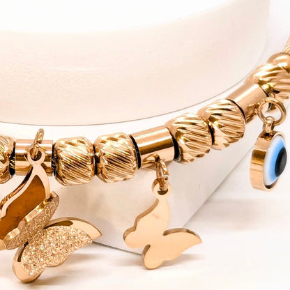 Elegant Rose Gold Bracelet with Evils Eye and Butterfly Charms