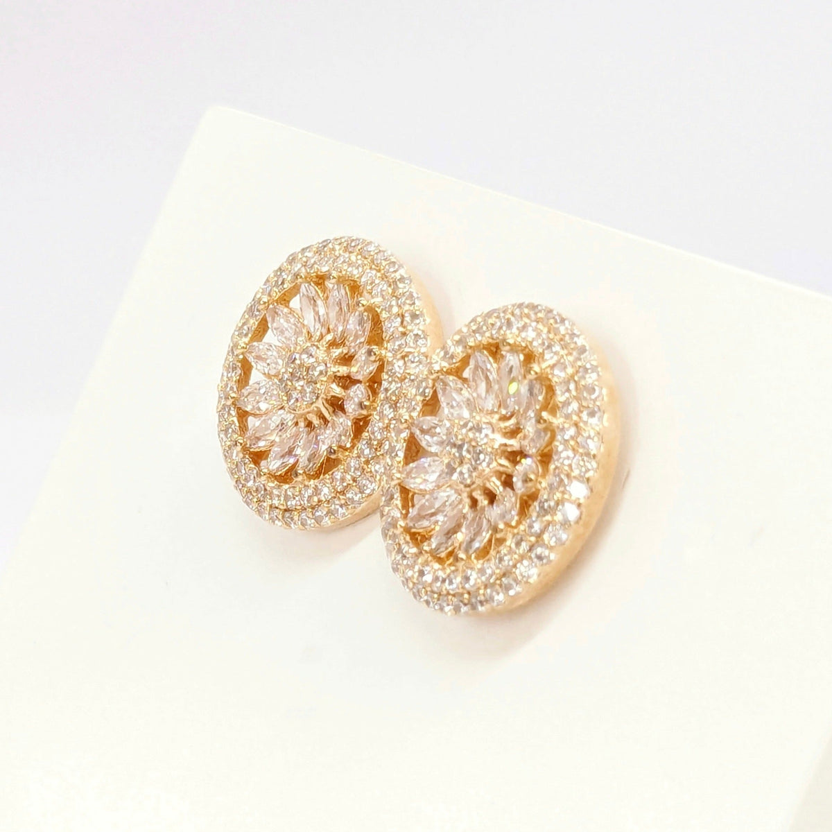 American Diamond Studded Earrings - Round Shape With Gold Finish.