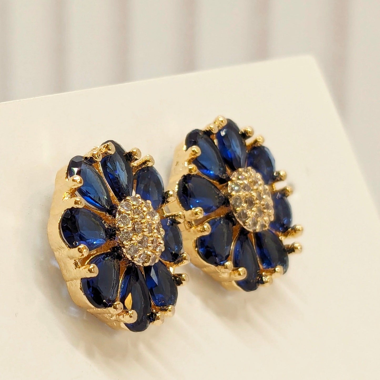 Fine Cut Navy Blue Stone Earring - Flower Pattern Studded with AD - Gold Finish