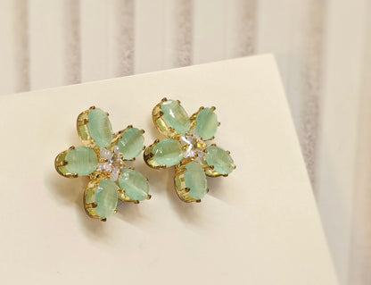 Sea Green Stone Flower Pattern AD Stud Earrings in Gold Finish