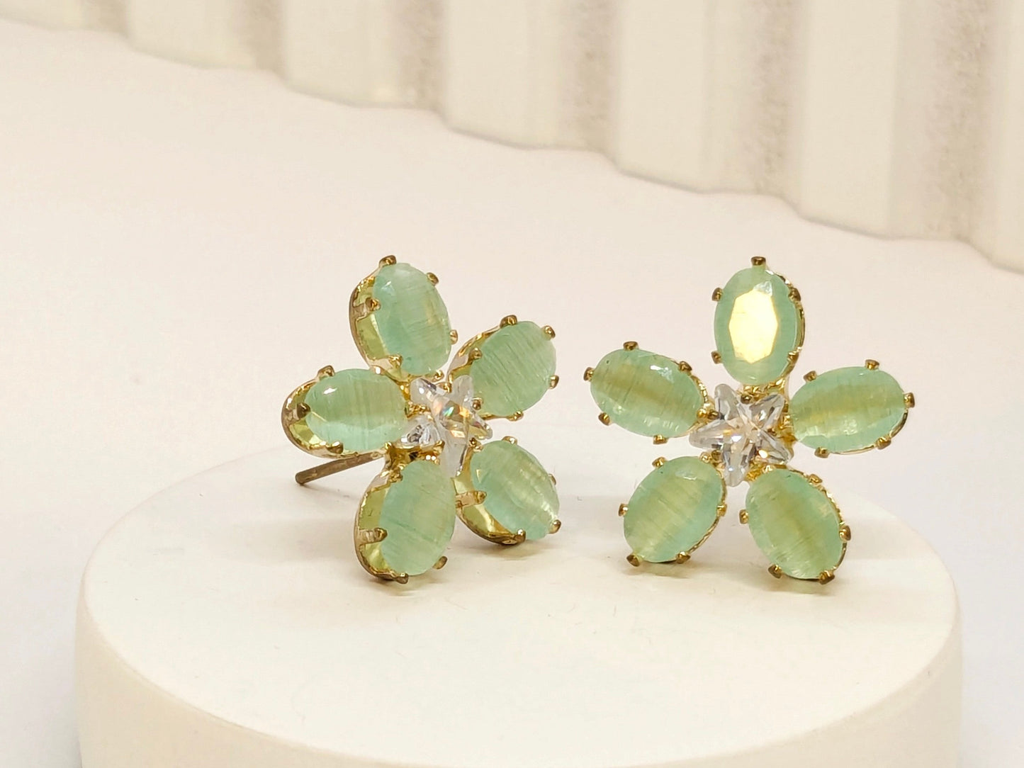 Sea Green Stone Flower Pattern AD Stud Earrings in Gold Finish