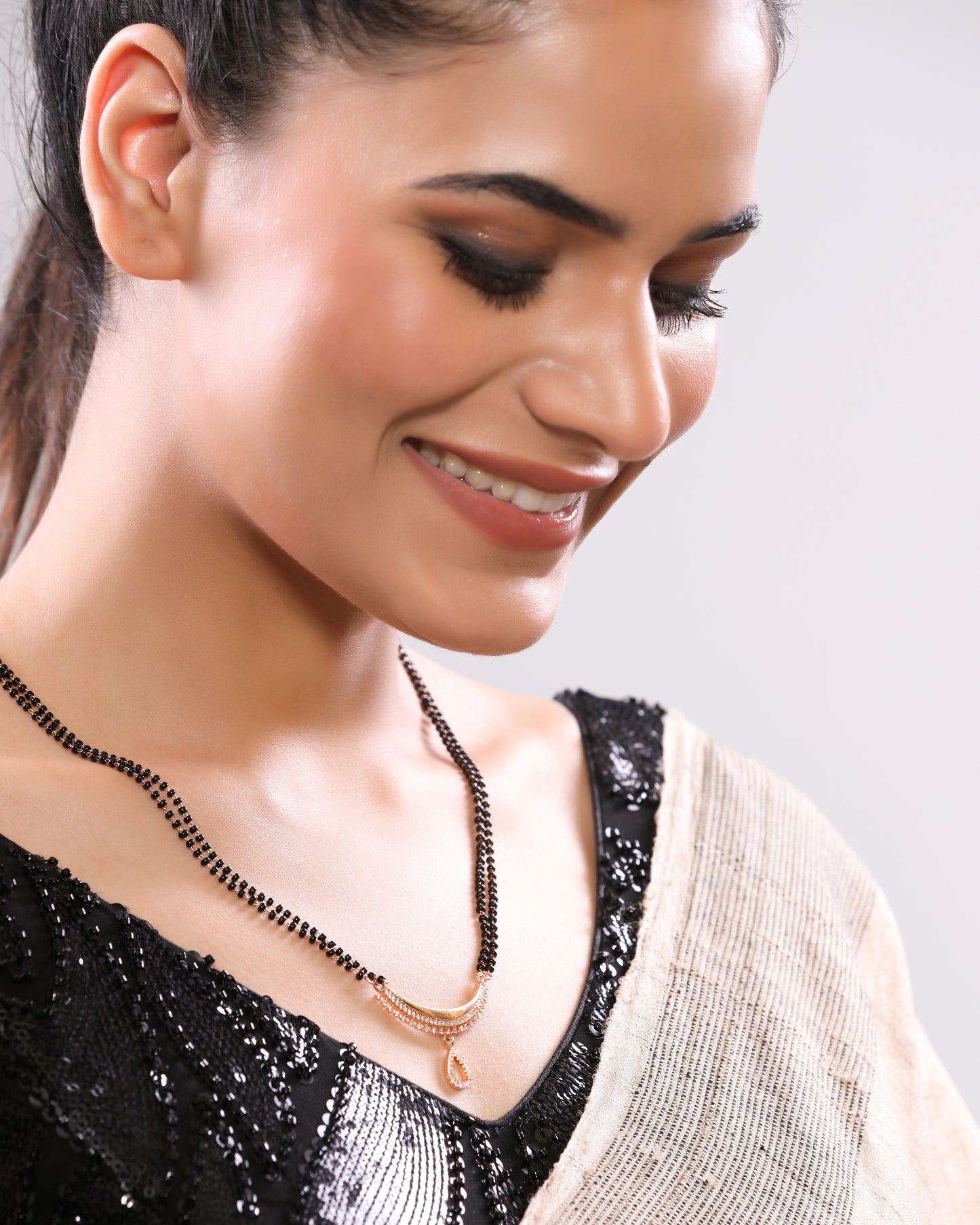 High Toned Rose Gold Plated American Diamond Studded Tripple Layer Drop Pendant Linear Chain Single Beaded Mangalsutra