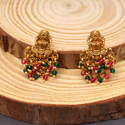 Traditional Temple Laxmi Studs in Brass 22KT Gold Plating Matte Finish studded with Red n Green Crystal Beads