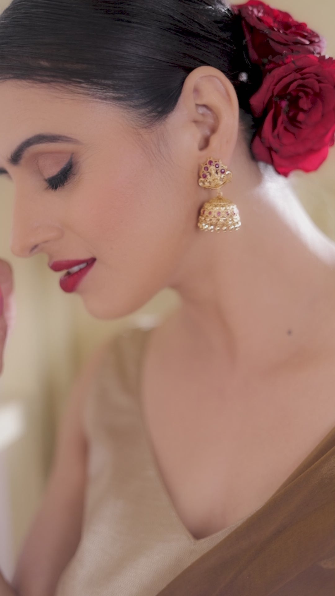 Timeless Faux Ruby Studded 22KT Gold Plated Brass Laxmi Temple Jhumka